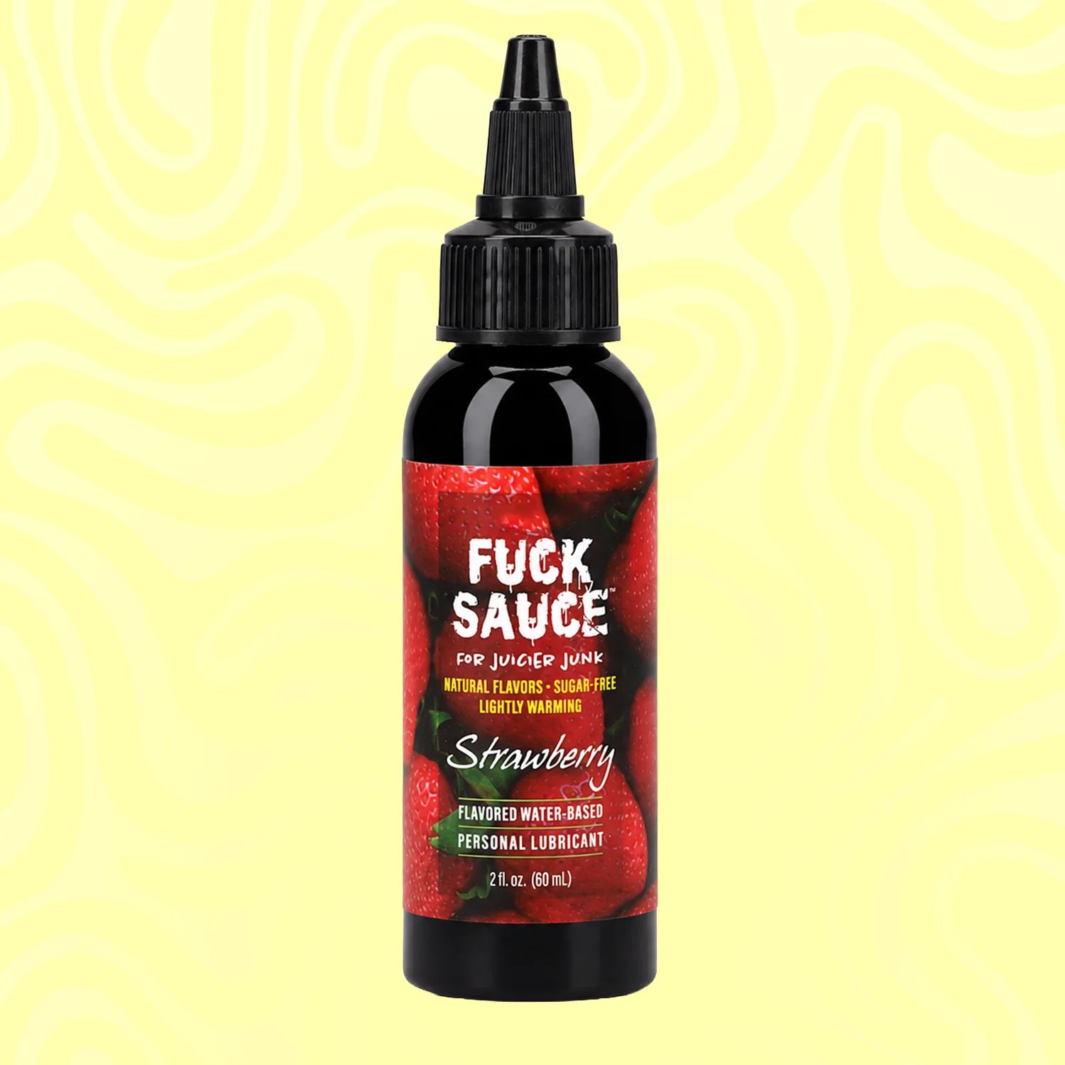 A bottle of Fuck Sauce Strawberry flavored water-based personal lubricant on a pale yellow background with wavy lines. The bottle is black with a red label featuring strawberries and white text.